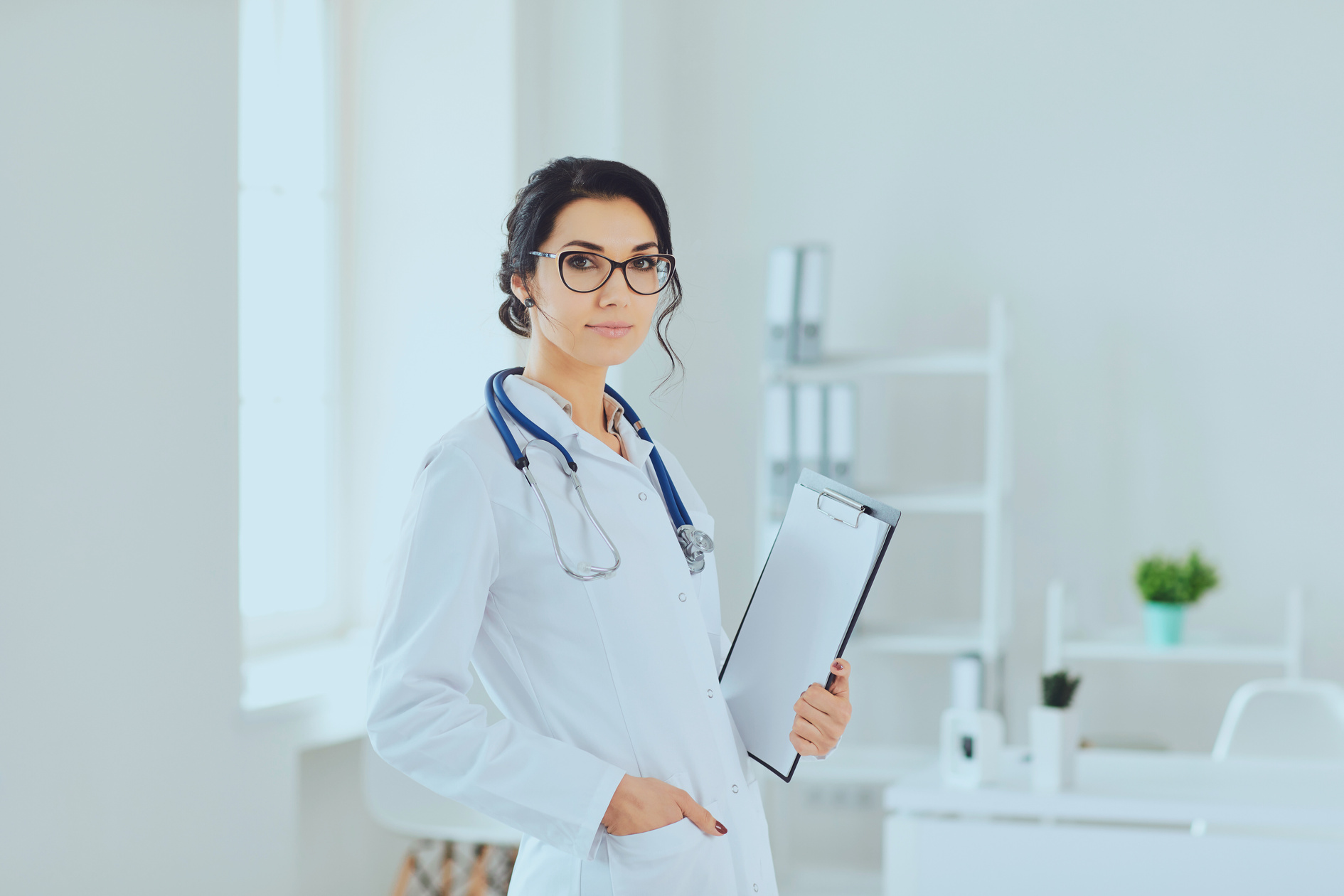 Professional Female Doctor with Clipboard in Office